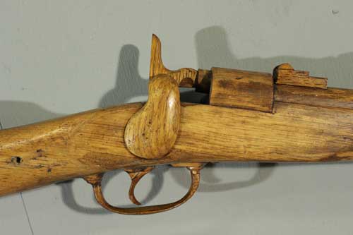 Detail of rifle carving after treatment.