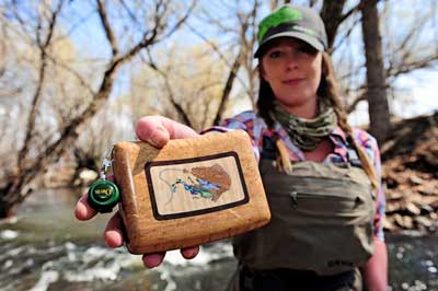 383TWWomanHoldingBoxWithLanyard