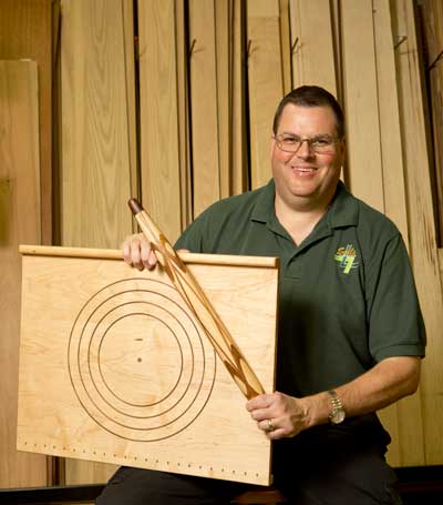 Mark Hensley with his third place entry in the turning category, a pastry board and rolling pin