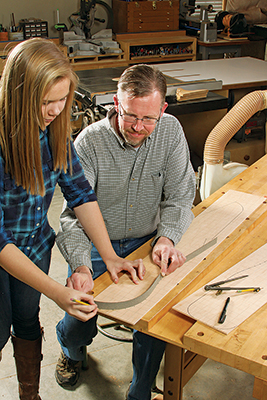 Chris and his daughter tracing out Adirondack chair templates