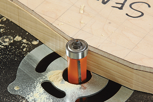 Trimming down chair part flush with template edge