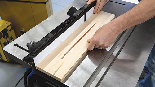 Routing slot for adjustable desk