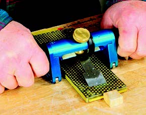 Spring-loaded front wheels on the Alisam let you press the tool down during honing.