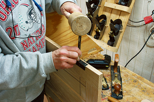 Marking screw hole in entertainment center door