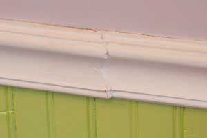 BADTRIM1 Here's a scarf joint that pulled wide open somewhere along the way. It isn't nailed over a stud, and the putty can't hide the mistake.