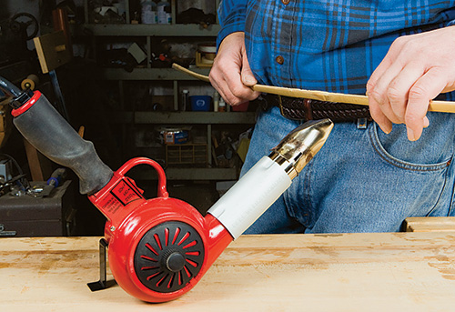 Using a heat gun to help shape bamboo slice