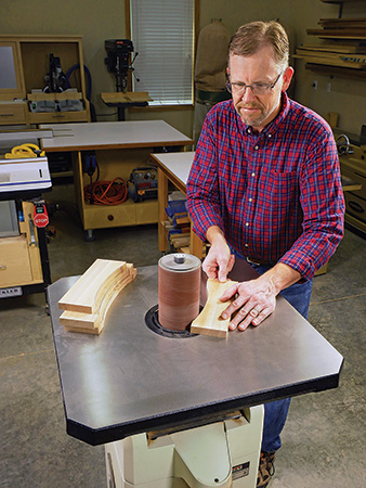 Smoothing adirondack chair parts with a drum sander