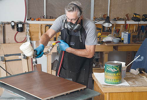 Spraying finish on outer portion of vanity side panel