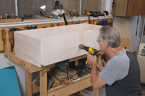 Cutting space for sink plumbing in vanity