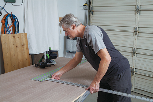 Measuring out vanity parts on plywood sheet