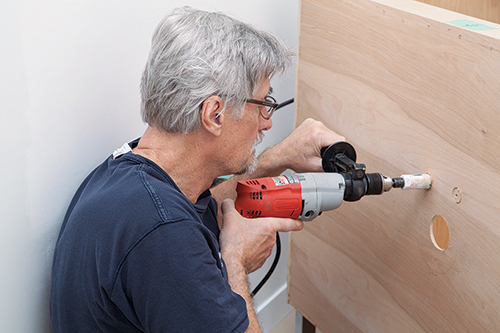 Drilling holes for bathroom vanity pipes
