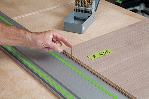 Measuring panel cut with drill bit