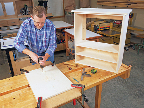 Cutting cable holes in tool cabinet back panel