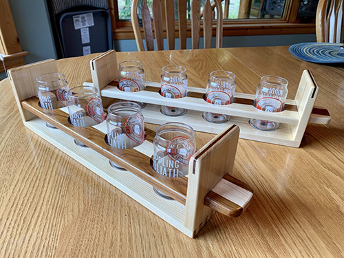 Two four glass beer paddles