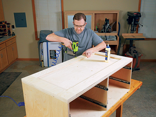 Gluing and nailing cleats to tool cart carcass base