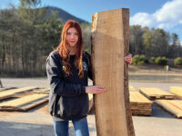 Showing off a freshly cut piece of black cherry lumber
