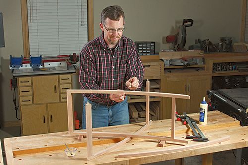 Joining tray table legs with hinge