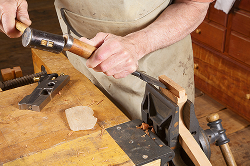 Trimming dovetails with hammer and chisel