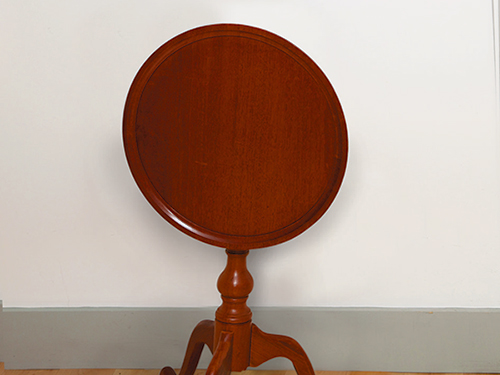 Candlestand tabletop folded down for storage