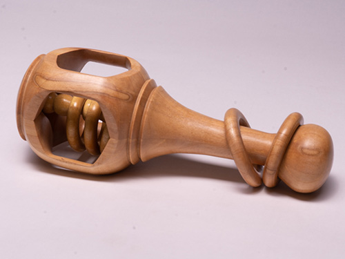 Turned baby rattle with multiple movable rings