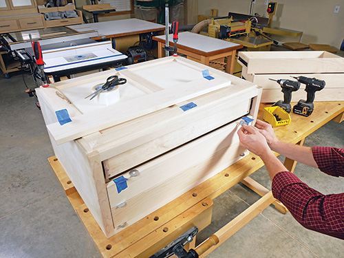Using spacers to aid in drawer face installation