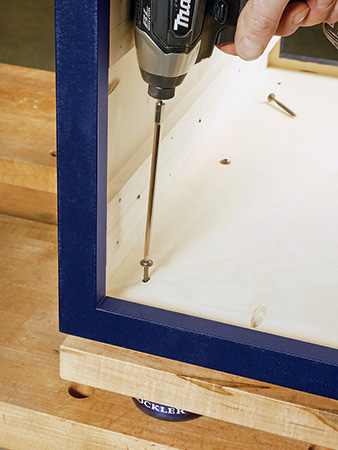 Screwing tabletop onto coffee table carcass