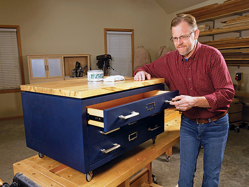 Chris Marshall showing off completed and waxed coffee table