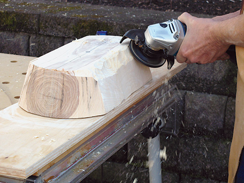 Beginning to carve the outside of the bowl blank