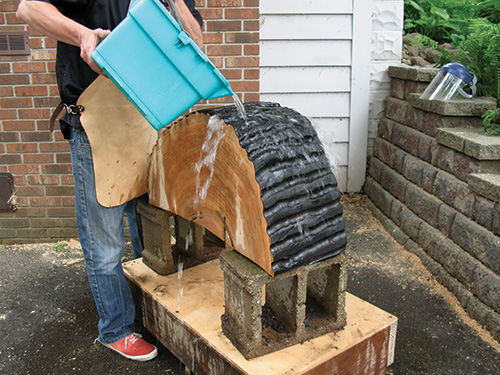 Cleaning cottonwood after burning to wash away loose pieces
