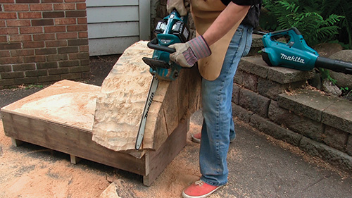 Chainsawing top layer off cottonwood piece for table