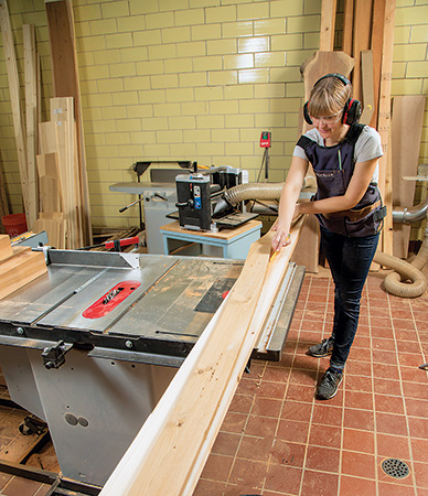 Tracing wave design on cedar potting bench slats