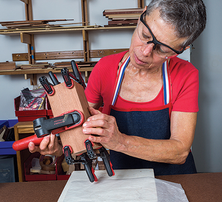 Using clamps to attach caddy box backing