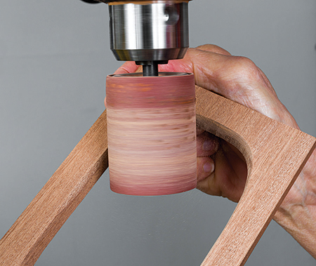 Smoothing interior of box lid with drum sander