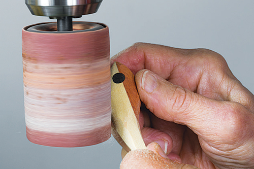 Sanding drawer pull with sanding drum