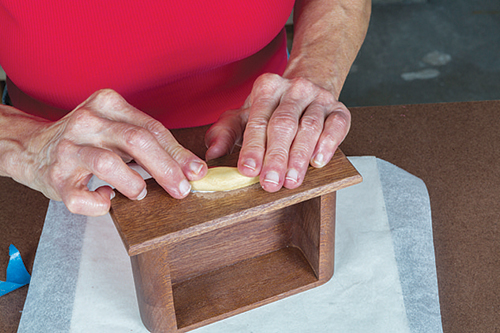 Fitting curved drawer pull on caddy box drawer