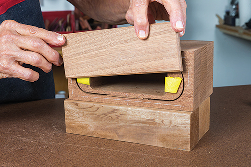 Test fitting drawer front on raised platform
