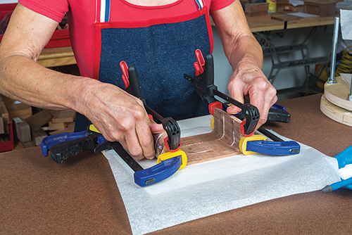 Clamping parts of curved drawer