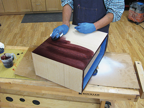 Spreading Cordovan dye over the base of the charging table