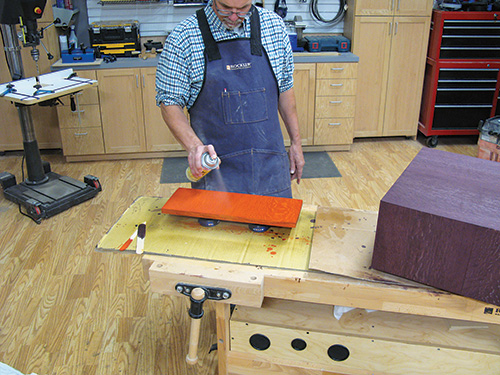 Sealing charging table door finish with aerosol shellac