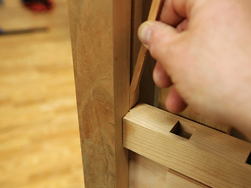 Adding filler strip in dog kennel stile groove