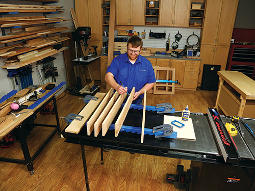 Laying out top panel for dog bed on panel clamps