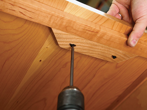 Installing cleats in top panel of dog kennel