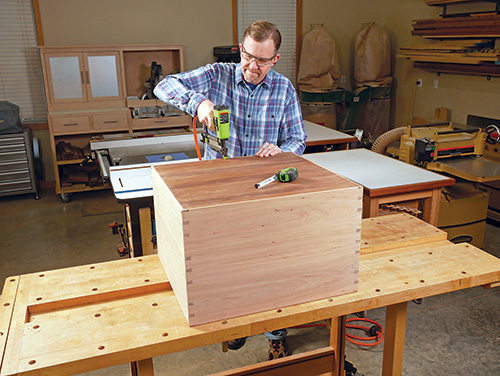 Attaching back panel to wine cabinet with brad nails