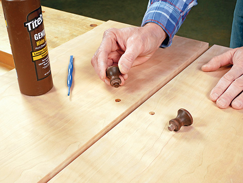 Shop-made walnut door knobs for wine cabinet