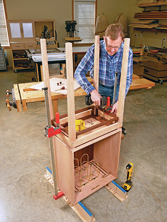 Installing Rev-A-Shelf wine cabinet hardware in cherry wine cabinet