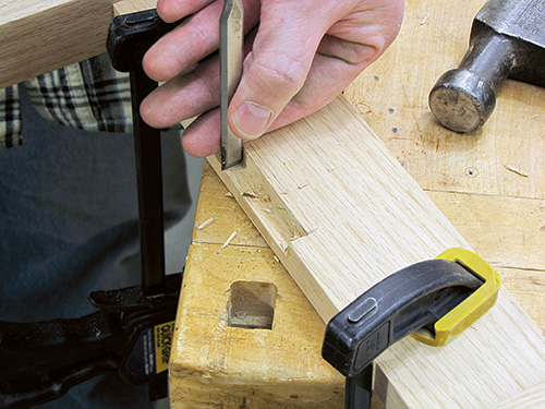 Cutting locking notch on Civil War table leg with chisel