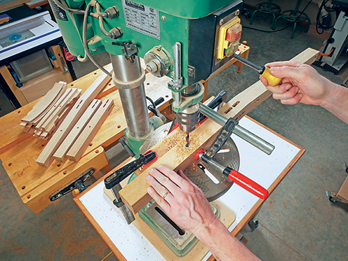 Using drill press to add dowel holes in cloud lift dining chair bottom rails