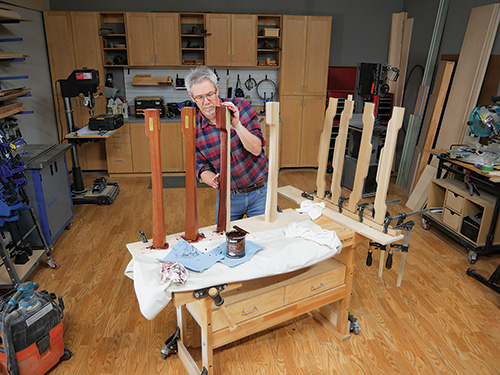 Rubbing mahogany stain into dining table legs
