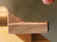 Trimming hall table braces with a hand saw