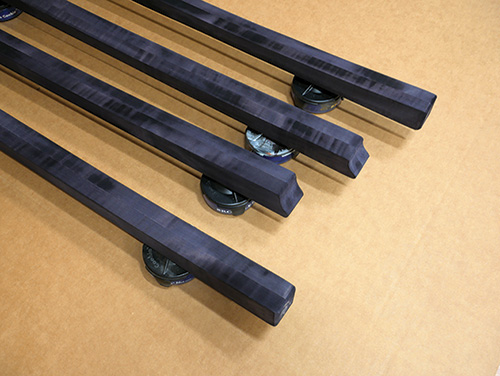 Freshly dyed table legs drying